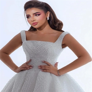 Elegant white bridal dress with square neck and all-over pearl bead embellishments