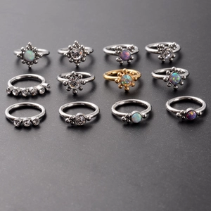 Detailed set of 12 stainless steel clicker rings with colorful opal and rhinestones