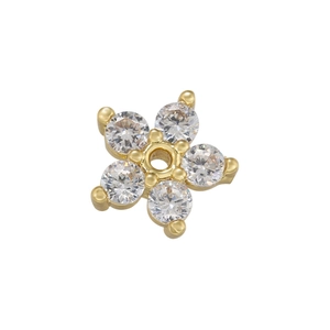 Detailed macro view of 18K gold flower pendant with five cubic zirconia stones and center hole