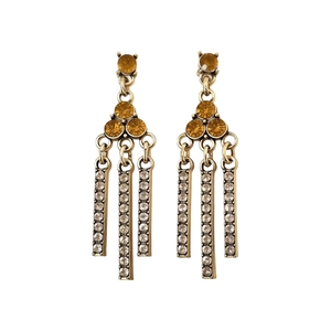 Vintage gold tassel earrings with amber crystals and sparkling rhinestones on white backdrop
