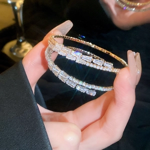 Macro shot of multi-layer sparkling zircon bracelet with gold finish and crystal details