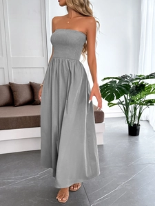 Detailed view of grey bandeau maxi dress showing elegant drape and tube top silhouette