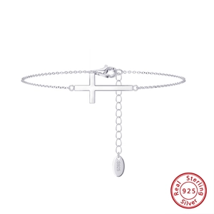 Minimalist S925 sterling silver cross bracelet with adjustable chain on white background