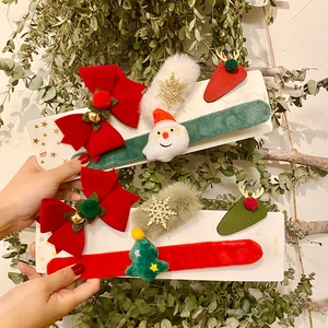 Christmas hair clips set featuring red velvet bows and plush Santa holiday hair accessories