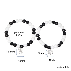 Detail showing dimensions and 20cm perimeter of spider and web beaded bracelets