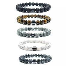 Detailed set of five beaded bracelets featuring tiger eye, lava rock and map stone
