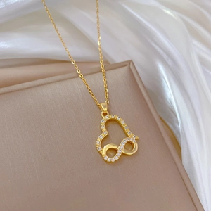 Gold titanium steel necklace with heart and infinity symbol pendant inlaid with crystals