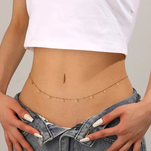Elegant 18k gold plated body chain with crown pendant on a female model's waist