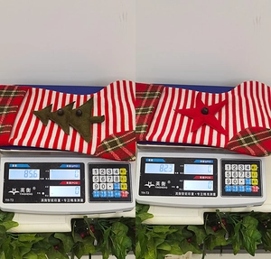 Weight comparison of festive knitted Christmas stockings with star and tree appliques