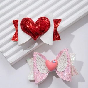 Pink and red glitter bow hair clips with heart sequins and wings for girls