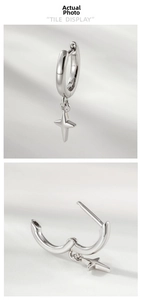 Polished silver star pendant hoop earring detail showing the secure hinge and smooth finish