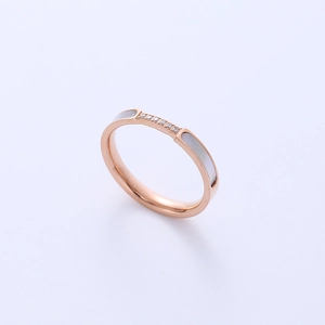 Elegant rose gold titanium steel ring featuring inlaid rhinestones and white shell accents