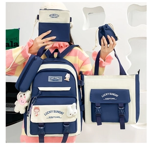 Five-piece set of navy blue and off-white canvas bags with backpack and tote bag