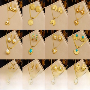 Collection of vintage gold-plated jewelry sets with turquoise and pearl accents