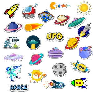 Flat lay of colorful cartoon space stickers including rockets, planets, and astronauts