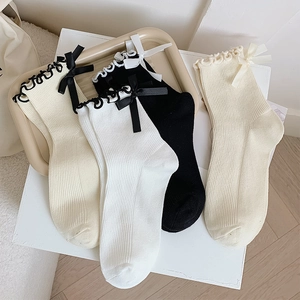 Japanese style frilly ankle socks with silk bows in black, white, and beige colors