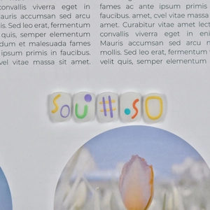 Close-up of 5D embossed nail stickers featuring colorful SOU#50 letters on white base