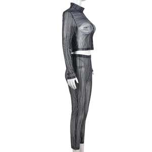 Detail of sheer mesh crop top and leggings set with black and white abstract stripes