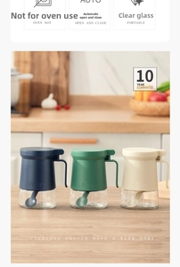 Three-piece seasoning bottle set in navy, green, and cream with glass body and lid spoons
