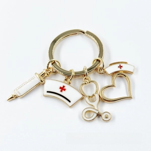 Detail of medical theme keychain with stethoscope, syringe and nurse hat charms