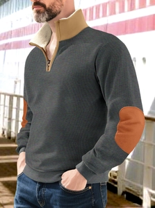 Detail of grey quarter-zip sweatshirt with vintage elbow patches and high neck design