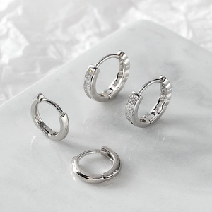 Minimalist silver pleated hoop earrings with sparkling cubic zirconia and polished finish