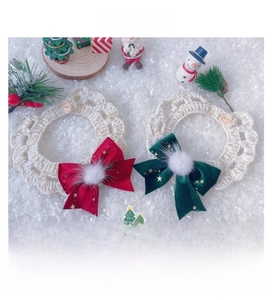 Detailed crochet pet collar with red and green velvet bows for Christmas styling
