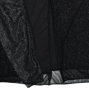 Macro shot of black mesh fabric with sparkling sequins and inner lining detail