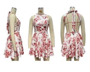 Detail of red floral halter dress featuring an open back and a large self-tie bow design