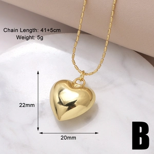 Detail view of gold heart pendant necklace showing 41+5cm chain and 22x20mm dimensions