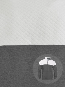 Close-up of quilted rhombic texture and white and grey color blocking sweatshirt