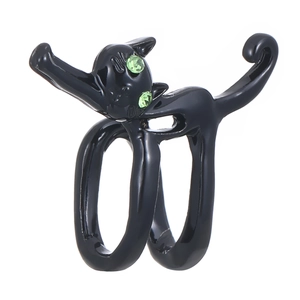 Gothic black cat wrap ring with green crystal eyes in a minimalist stretching pose