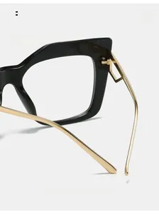 Detail of curved metal temples and black frame for comfortable wear and stylish fit
