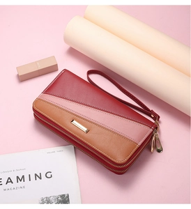 Three-color gradient patchwork long wallet with double zippers and wrist strap detail