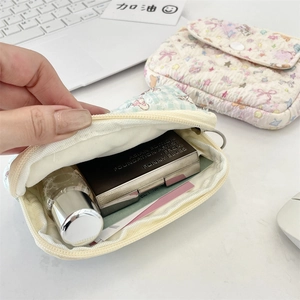 Quilted floral cotton pouches showing interior storage for cosmetics and accessories
