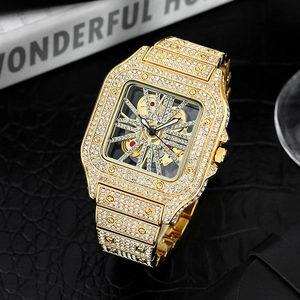 Macro shot of gold square skeleton watch with luxury diamond-set bezel and band