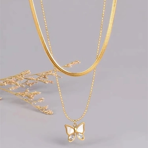 Double-layered gold butterfly necklace featuring flat snake chain and bead chain design