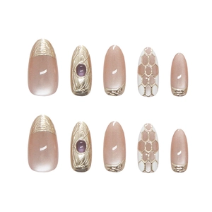 Handmade purple gemstone press-on nails with hollow gold diamond patterns and embossed art