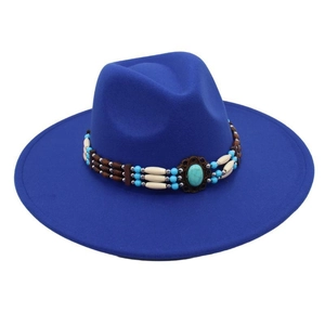 Detail of navy fedora with ethnic beaded band and large turquoise stone ornament
