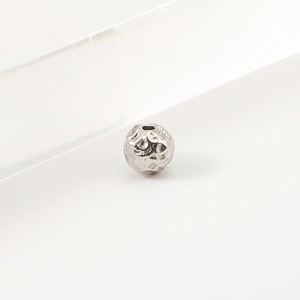 Macro shot of silver stainless steel hammered texture beads for DIY jewelry making