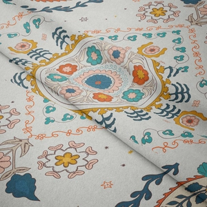 Close-up of bohemian floral tapestry fabric showing intricate texture and mandala patterns