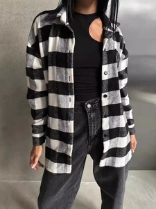 Women's vintage black and white plaid flannel shirt with a relaxed fit for autumn