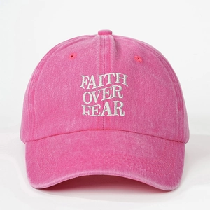 Pink washed cotton baseball cap featuring white Faith Over Fear embroidery
