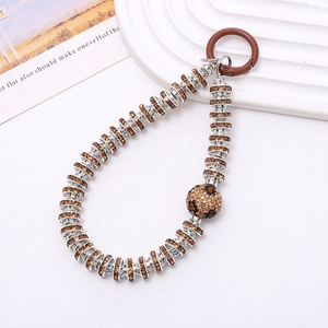 Close-up of leopard pattern crystal ball keychain with brown rhinestones and metal hook
