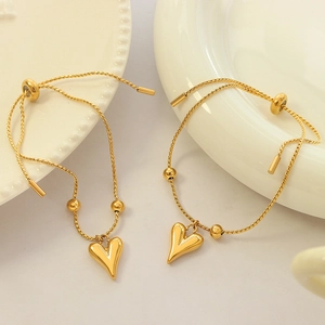 Gold stainless steel heart pendant bracelet with adjustable pull sliding clasp