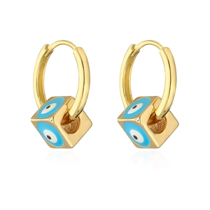 Macro detail of 18K gold plated cube earrings with blue evil eye enamel patterns