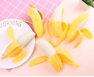 Flat lay of multiple realistic squishy peeled bananas showing white fruit texture detail