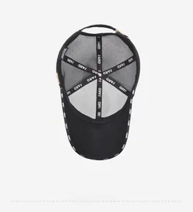Detail view of the breathable mesh interior and adjustable strap of the black baseball cap