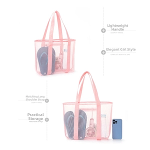 Detail of pink mesh beach bag showing large capacity for flip-flops and water bottles