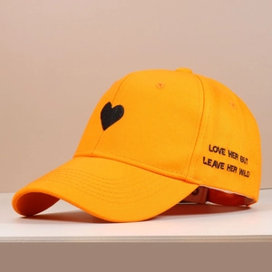 Detail of orange cotton baseball cap with heart embroidery and Love Her But Leave Her Wild text